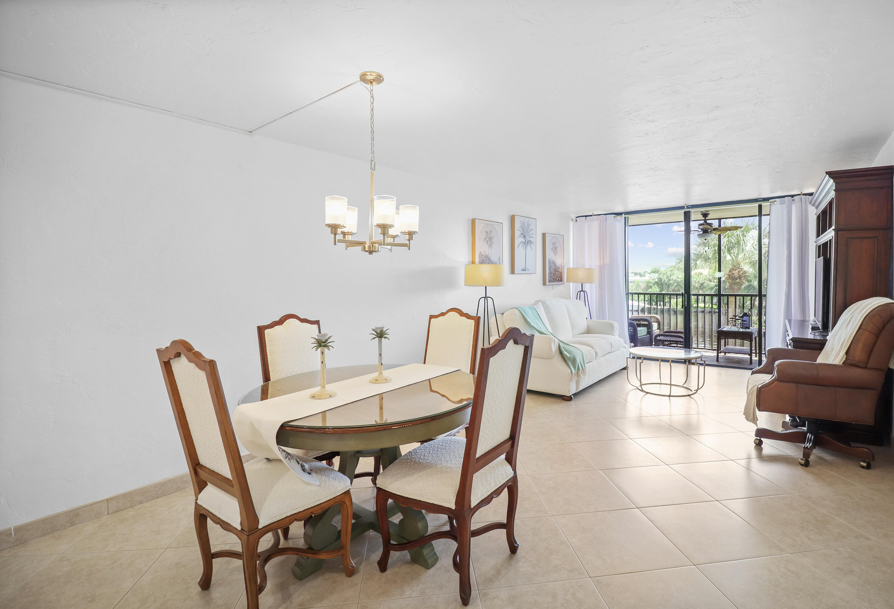 13 Royal Palm Way, Unit 302 Boca Raton, FL 33432 - Photo 7 of 31 a view of a dining room with furniture a livingroom and chandelier