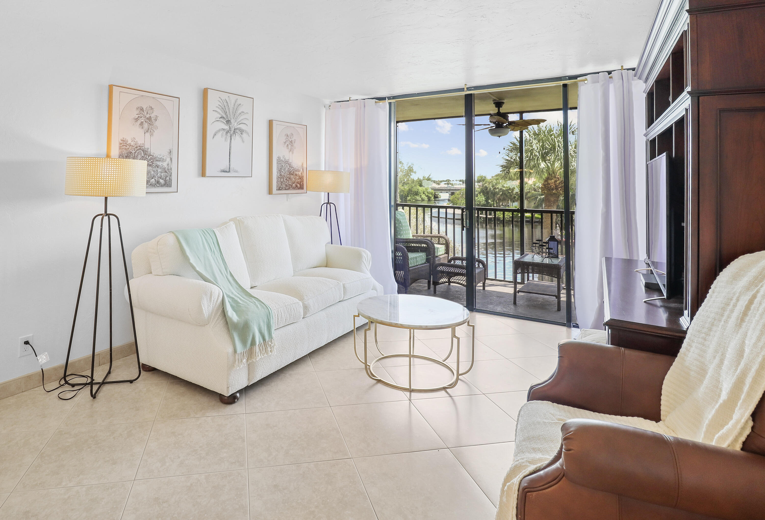 13 Royal Palm Way, Unit 302 Boca Raton, FL 33432 - Photo 8 of 31 a living room with furniture and a large window
