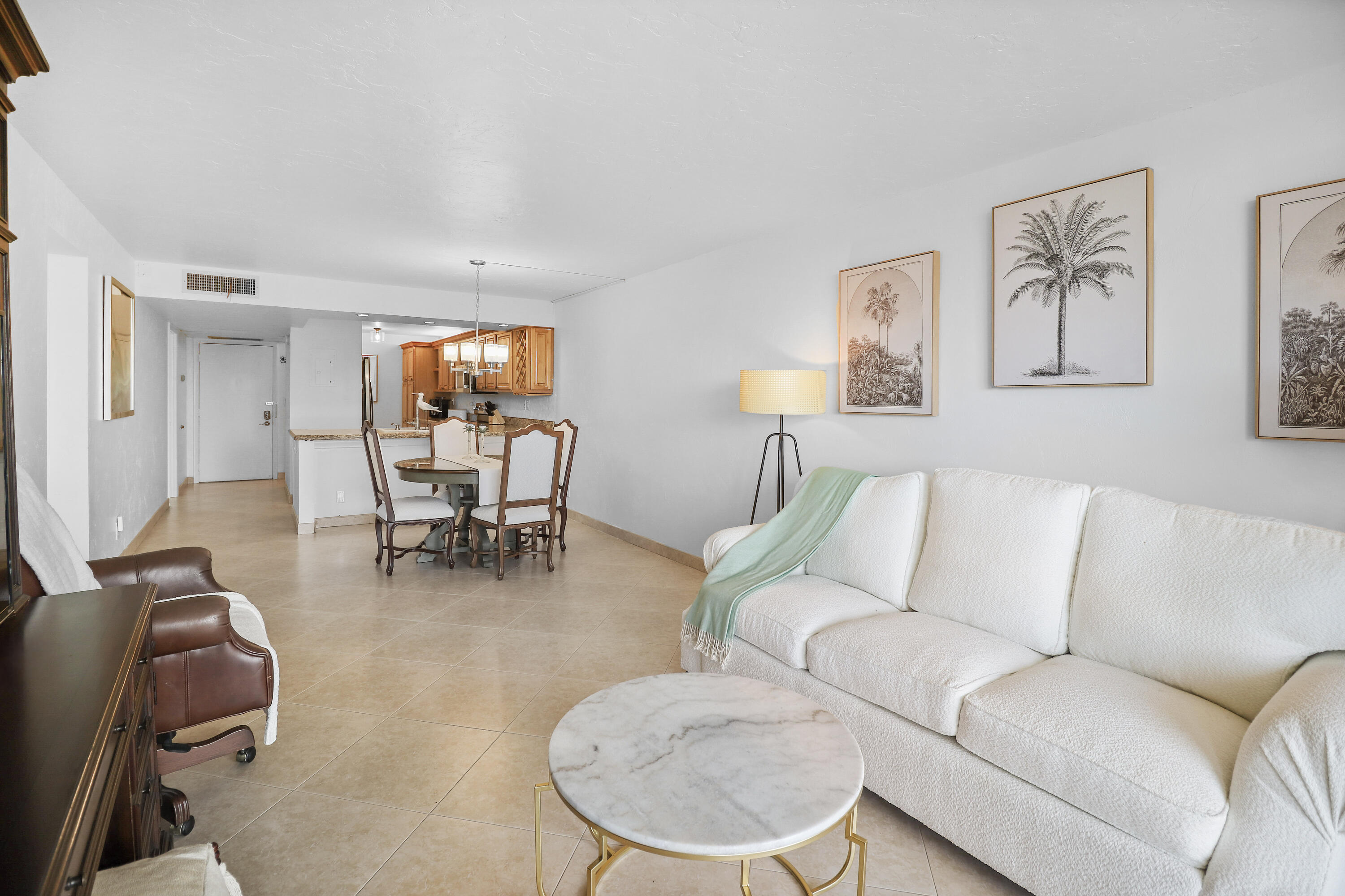 13 Royal Palm Way, Unit 302 Boca Raton, FL 33432 - Photo 10 of 31 a living room with furniture and kitchen view