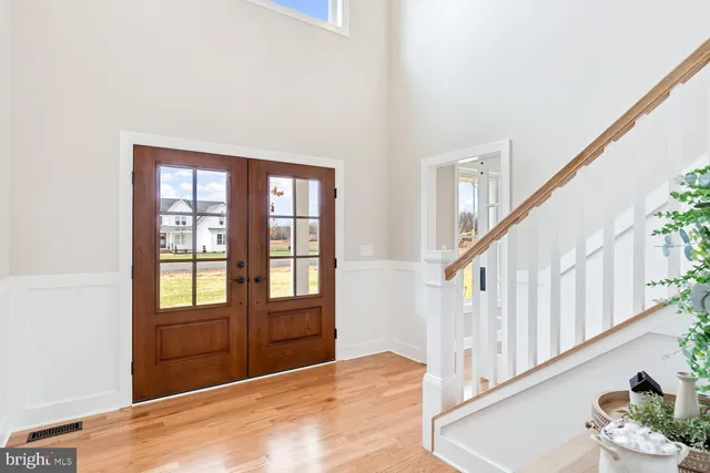 a kitchen with kitchen island granite countertop a sink appliances cabinets and a counter top space