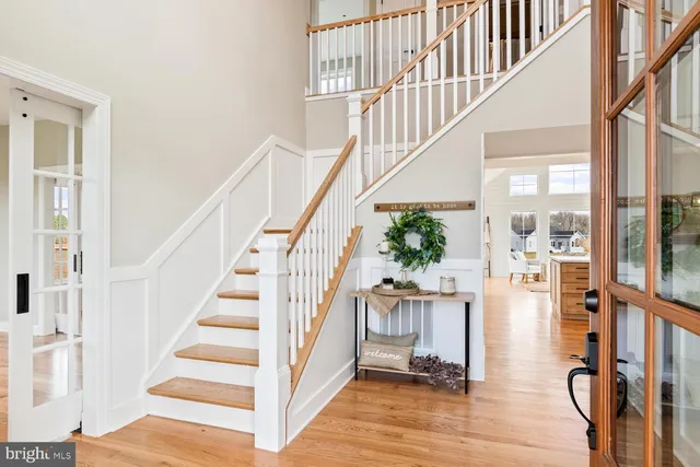 a kitchen with stainless steel appliances a sink stove and cabinets