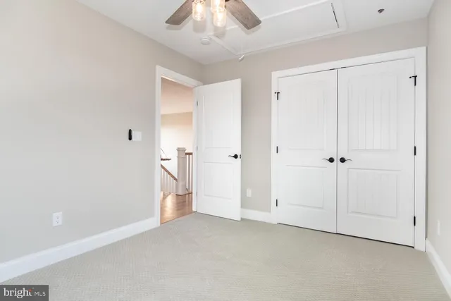 a bathroom with a granite countertop sink a shower and a mirror