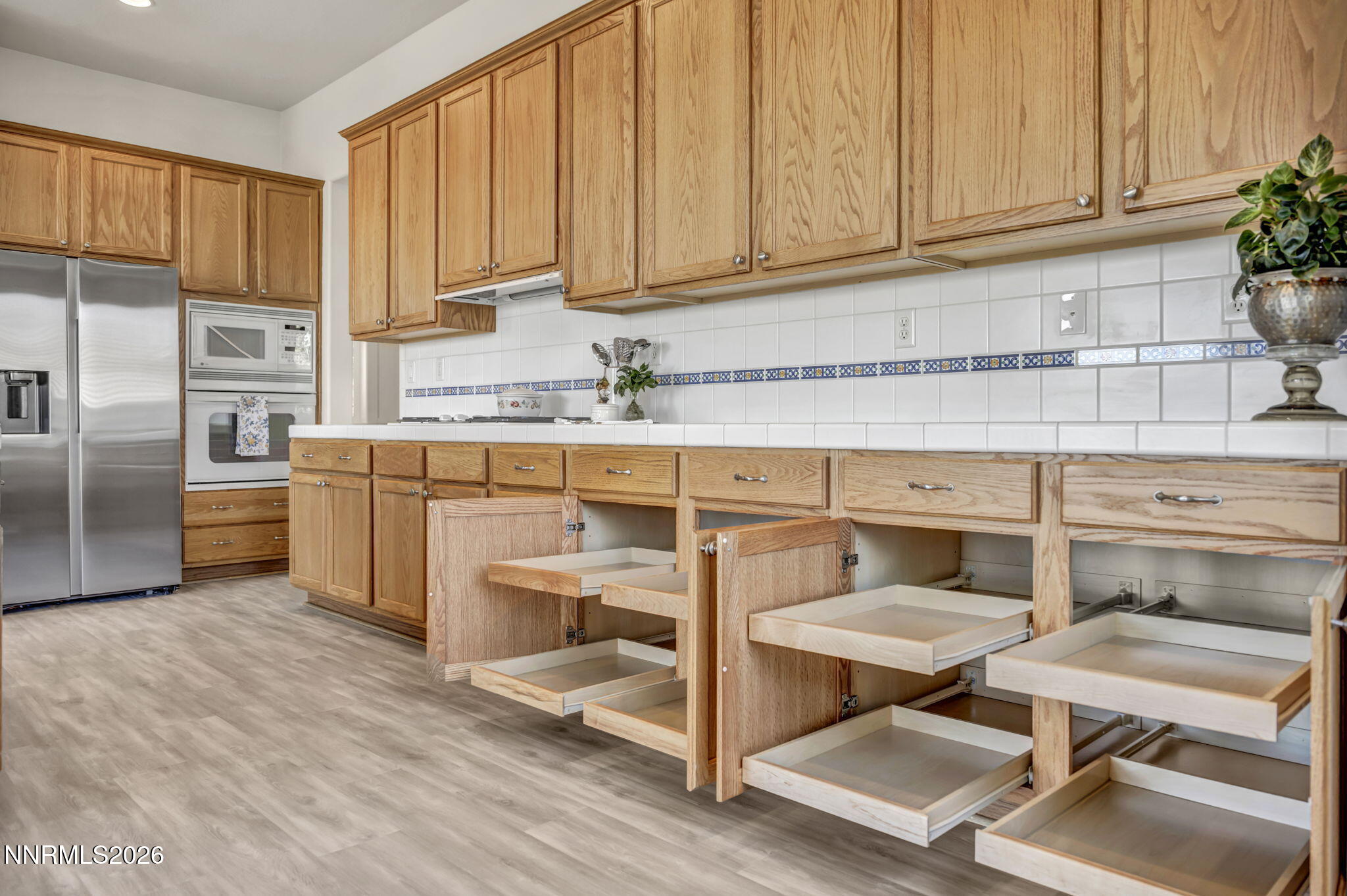 574 Echo Ridge Court Reno, NV 89511 - Photo 26 of 58 a kitchen with a sink cabinets and stainless steel appliances