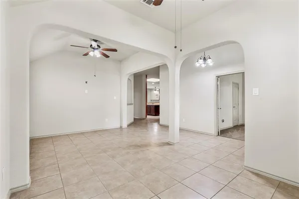 a view of an empty room with a bathroom
