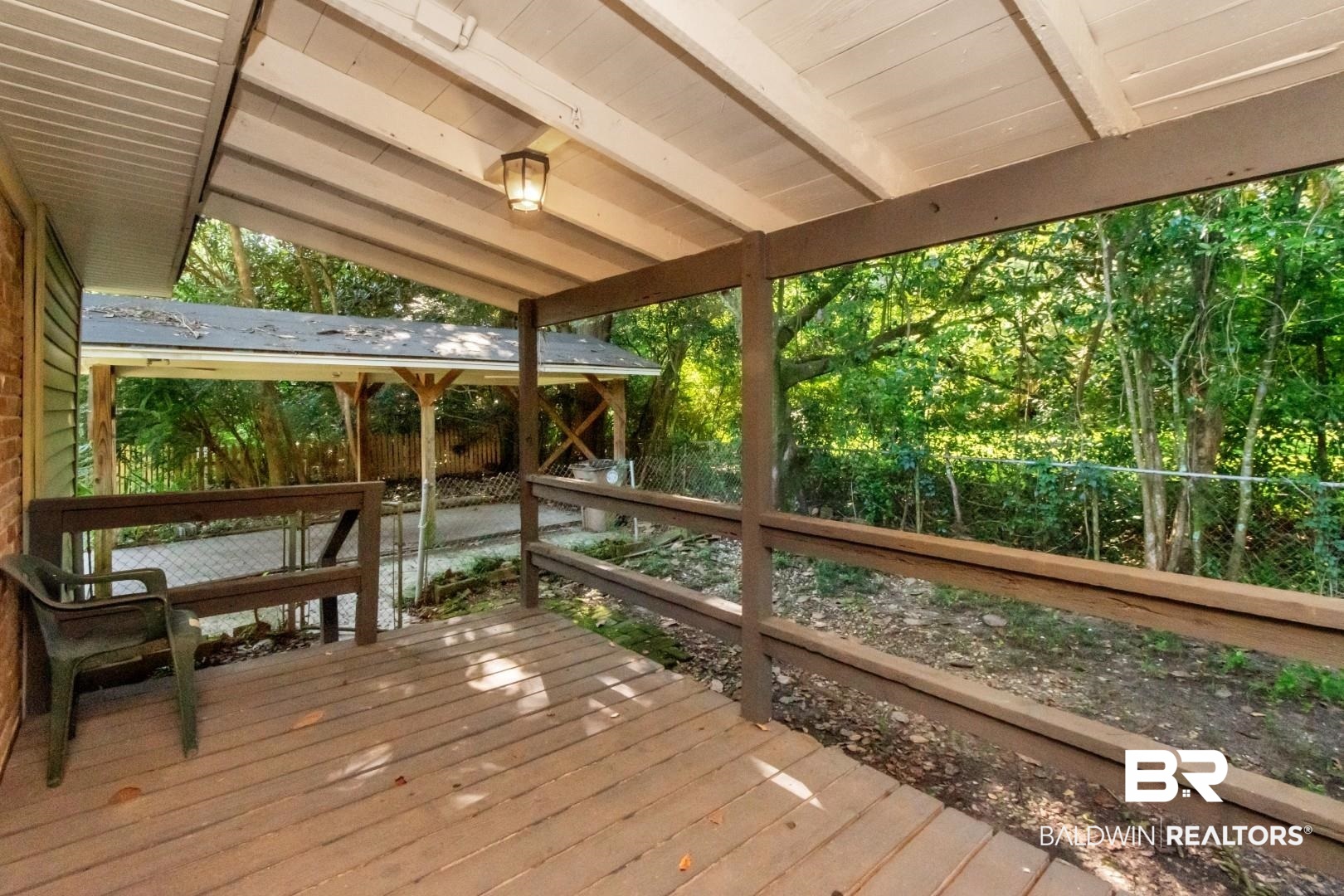 2105 Upham Court Mobile, AL 36607 - Photo 24 of 32 Wooden terrace with a fenced backyard