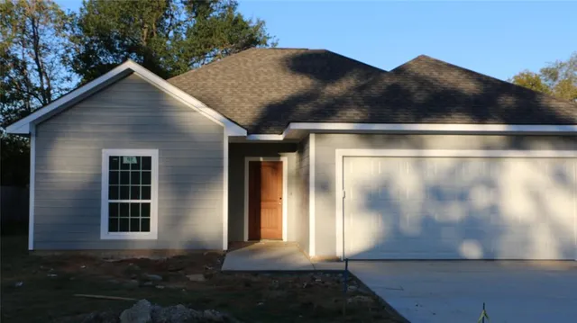 a side view of house with yard