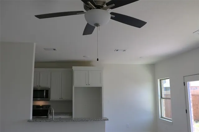 a view of kitchen and utility room