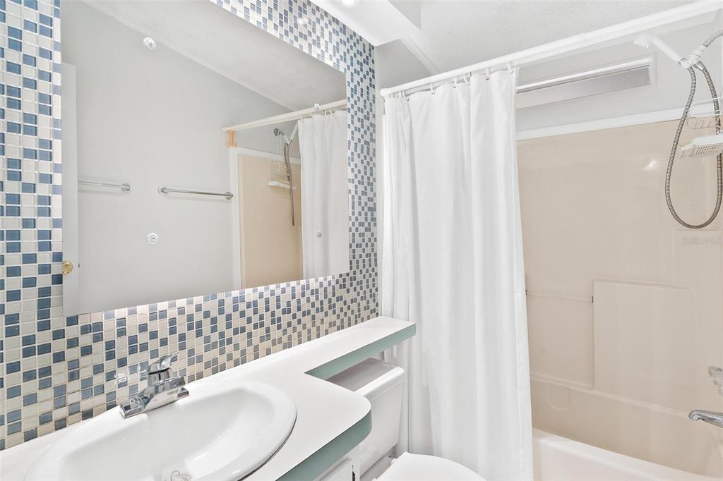 36832 Wilmington Road Fruitland Park, FL 34731 - Photo 12 of 14 a bathroom with a sink and a mirror