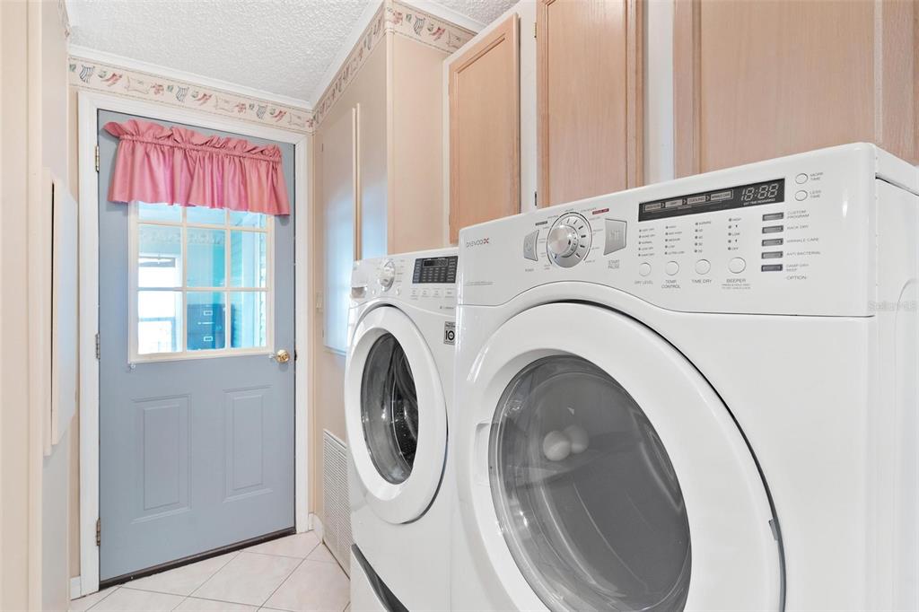 36832 Wilmington Road Fruitland Park, FL 34731 - Photo 13 of 14 a utility room with dryer and washer