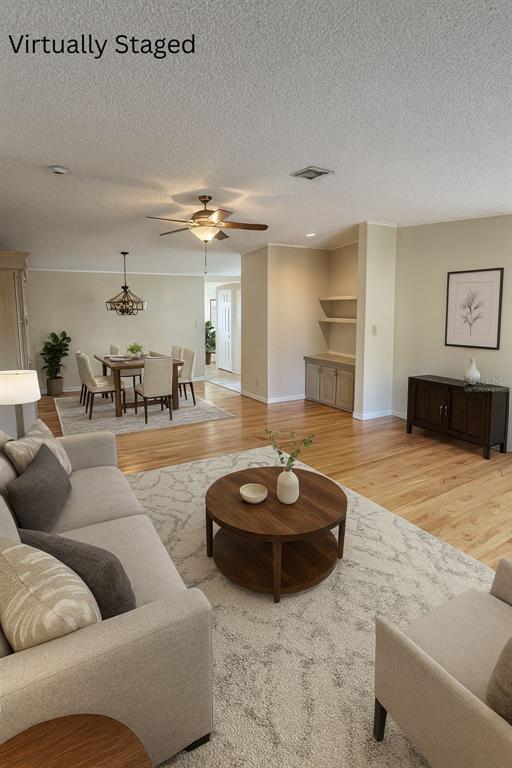 36832 Wilmington Road Fruitland Park, FL 34731 - Photo 2 of 14 a living room with furniture and a couch