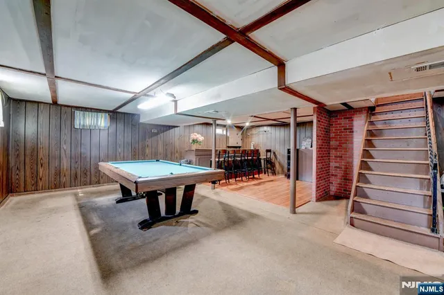 a room with furniture and a ceiling fan