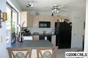 135 Hodgson Road Charlotte, NC 28211 - Photo 3 of 7 a kitchen with a refrigerator and a sink
