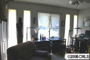 135 Hodgson Road Charlotte, NC 28211 - Photo 6 of 7 a living room with couches and large closet with wooden floor