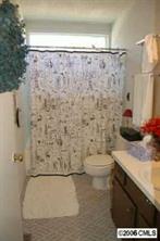 135 Hodgson Road Charlotte, NC 28211 - Photo 7 of 7 a bathroom with a granite countertop toilet and a sink