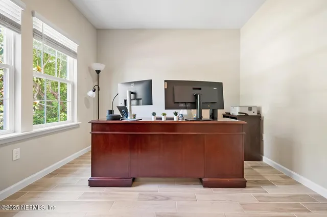 a view of living room with furniture and a window