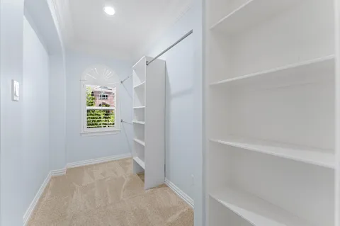 a view of a patio with a table chairs and a yard