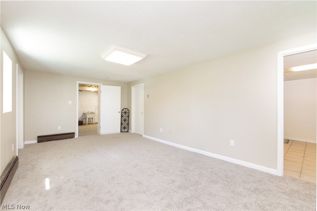 12379 Portage Street Rittman, OH 44270 - Photo 36 of 44 Finished basement area with full bathroom and walkout
