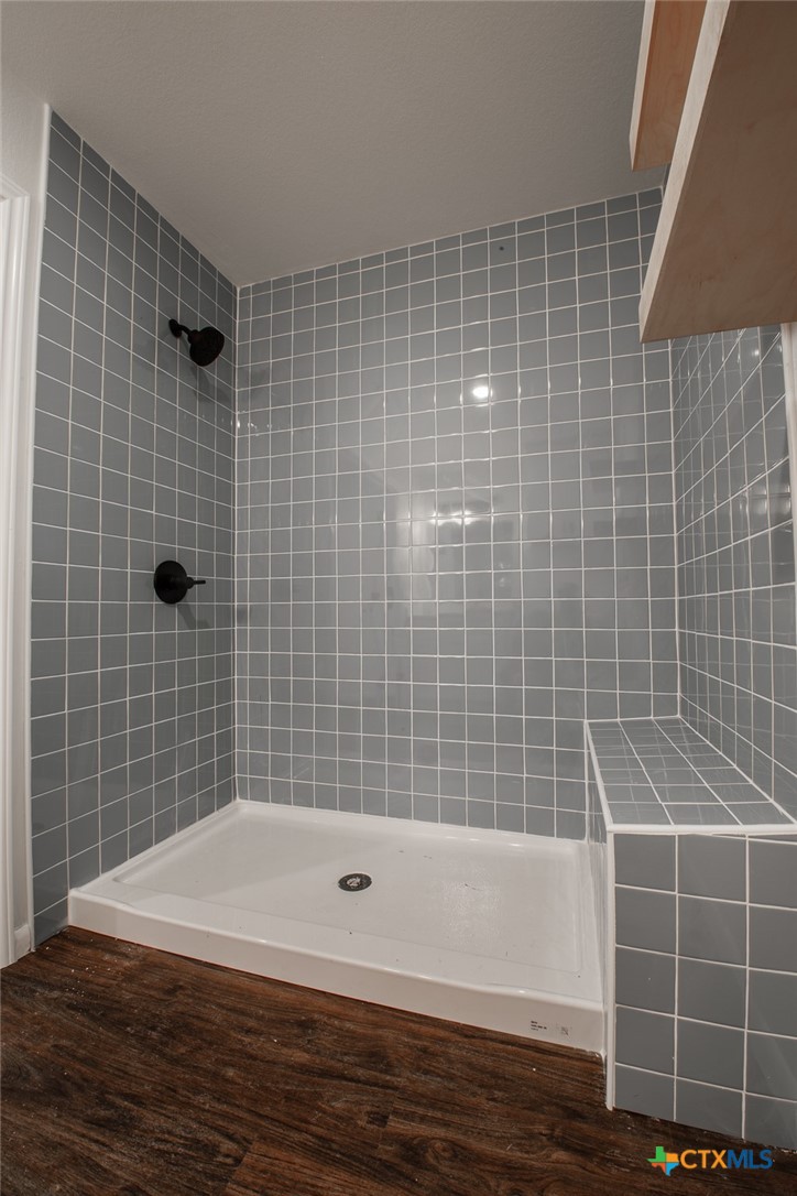2019 South 9th Street Temple, TX 76504 - Photo 19 of 23 Primary beth with beautifully tiled walk in showers.