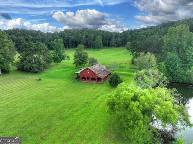a view of a lake with a yard