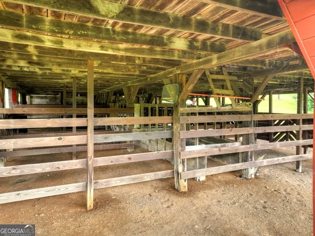 a living room with furniture ceiling fan and a window