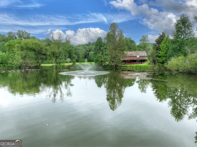 a spacious bedroom with a bed and a fireplace