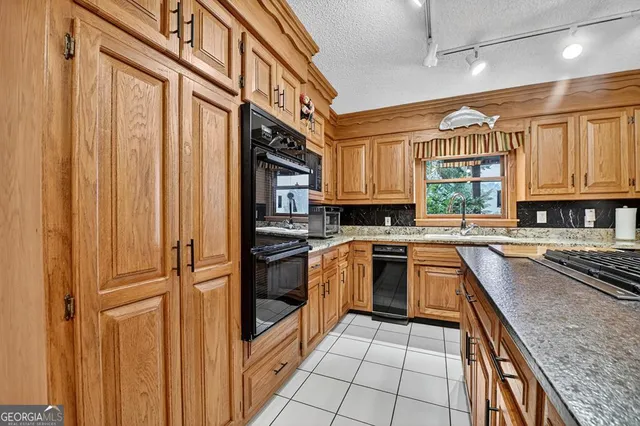 a dining room with furniture and a window