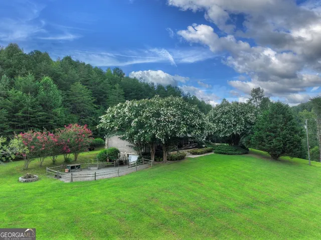a view of a hallway with paintings on the wall