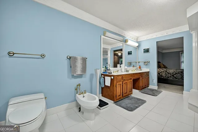 a backyard of a house with a yard and outdoor seating