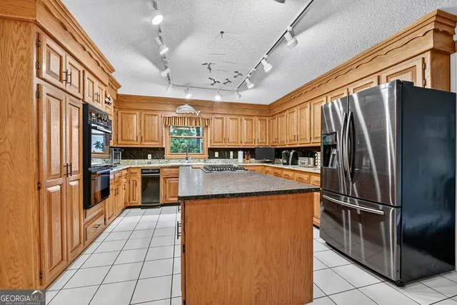 a house with a flower garden in front of it