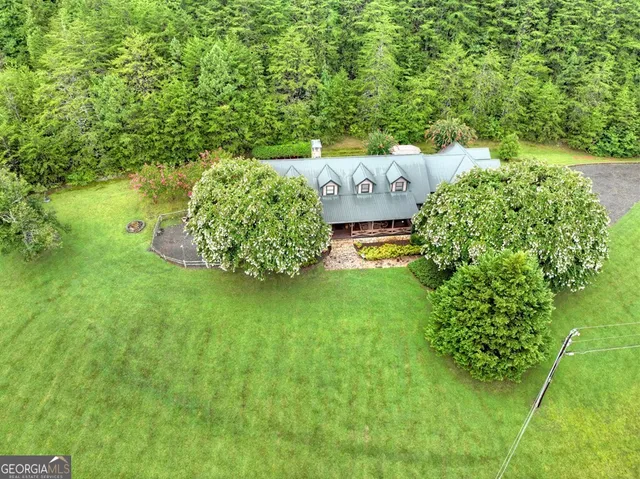 a backyard of a house with lots of green space
