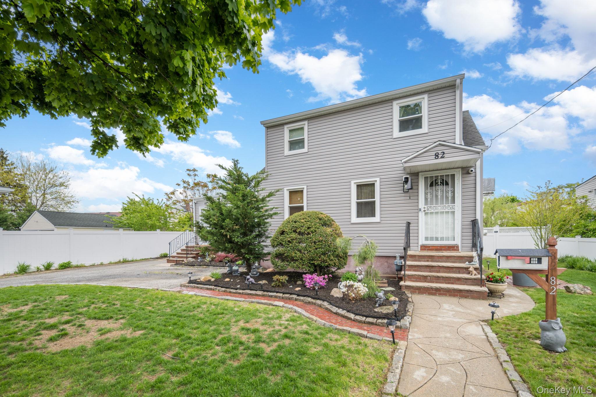 82 Nottingham Avenue Valley Stream, NY 11580 - Photo 1 of 30 Two-story residence featuring gray siding and white trim windows