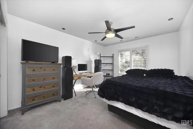 a work room with furniture and a window