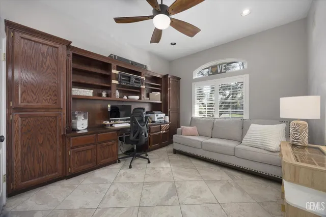 a bathroom with a granite countertop sink mirror vanity and toilet