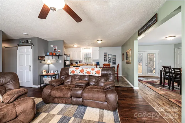 a living room with furniture fireplace and flat screen tv