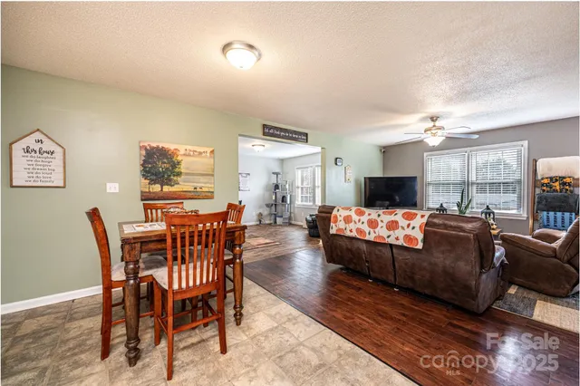 a view of a livingroom with furniture and wooden floor