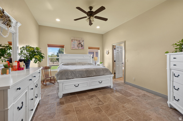 4635 East Sunny Acres Lane Moab, UT 84532 - Photo 49 of 56 Spacious room featuring vaulted ceilings, recessed lighting, a ceiling fan, and large format stone tile flooring