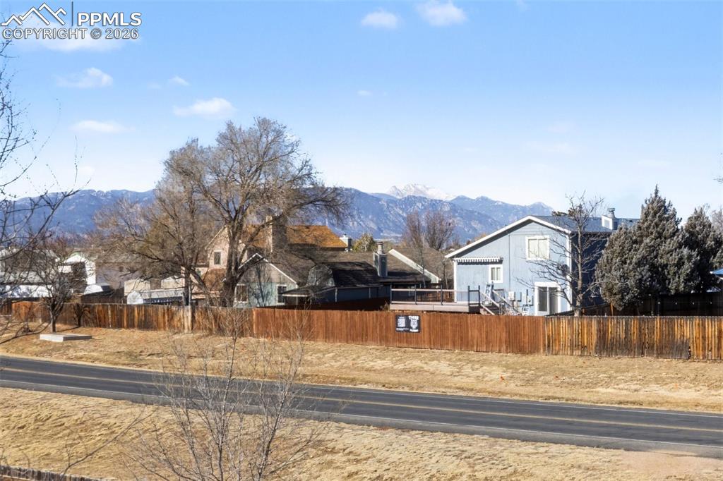 921 Candlestar Loop North Fountain, CO 80817 - Photo 19 of 23 a view of a house with a yard