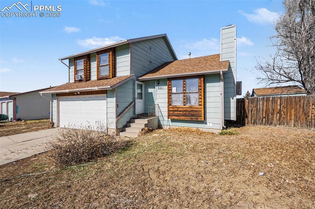 921 Candlestar Loop North Fountain, CO 80817 - Photo 2 of 23 a front view of a house with a yard