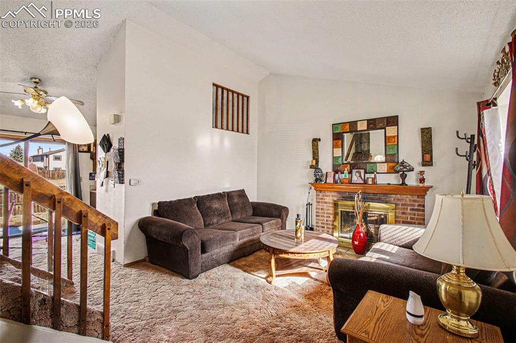 921 Candlestar Loop North Fountain, CO 80817 - Photo 4 of 23 a living room with furniture and a flat screen tv