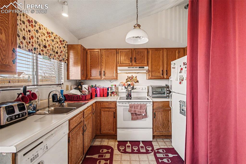 921 Candlestar Loop North Fountain, CO 80817 - Photo 7 of 23 a kitchen with a sink cabinets and window