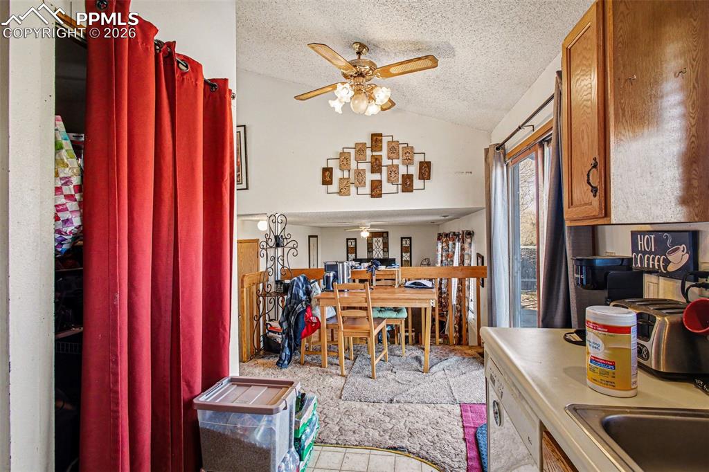 921 Candlestar Loop North Fountain, CO 80817 - Photo 10 of 23 a view of a living room with furniture and a chandelier