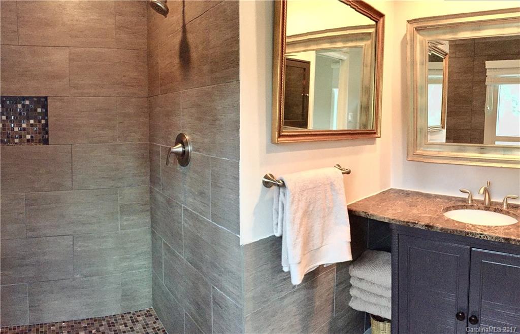 330 Whitestone Road Charlotte, NC 28270 - Photo 11 of 23 a bathroom with a granite countertop shower a sink and a mirror