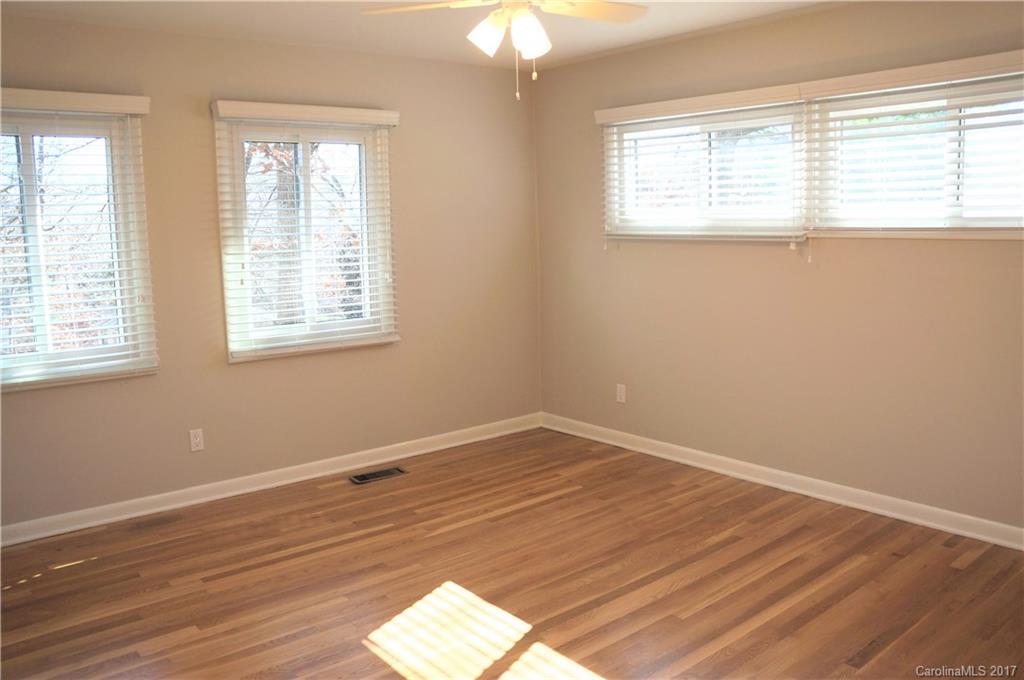 330 Whitestone Road Charlotte, NC 28270 - Photo 12 of 23 an empty room with wooden floor and windows