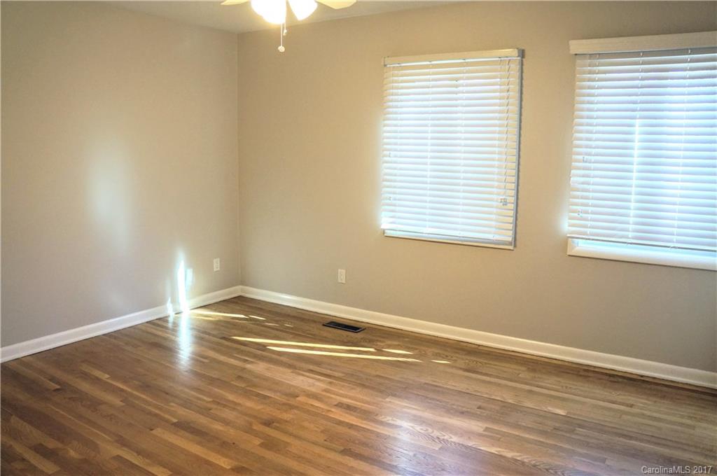 330 Whitestone Road Charlotte, NC 28270 - Photo 14 of 23 a view of an empty room with wooden floor and a window