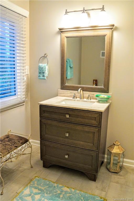 330 Whitestone Road Charlotte, NC 28270 - Photo 16 of 23 a bathroom with a sink and a mirror