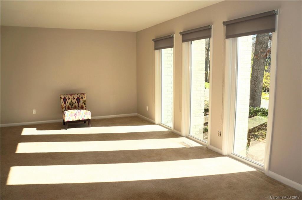 330 Whitestone Road Charlotte, NC 28270 - Photo 8 of 23 a view of a bedroom with wooden floor and a window