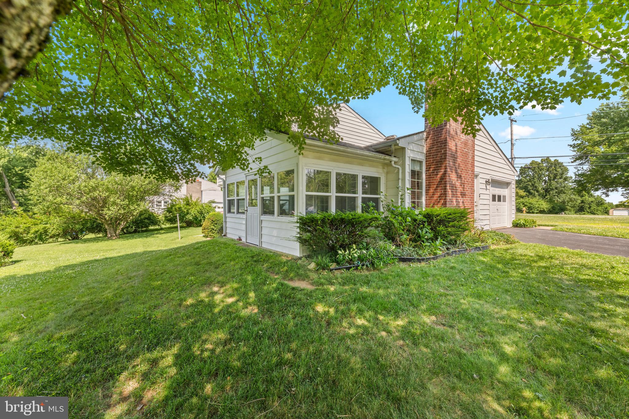 258 Monacy Road Coatesville, PA 19320 - Photo 14 of 54 a front view of house with yard and trees
