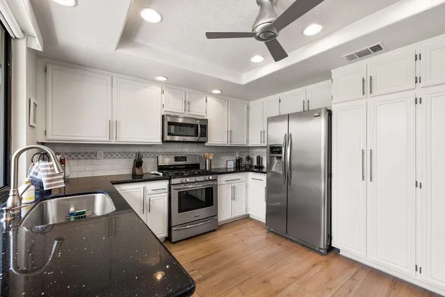 a view of a patio with swimming pool