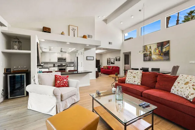 a view of a patio with a table chairs and backyard