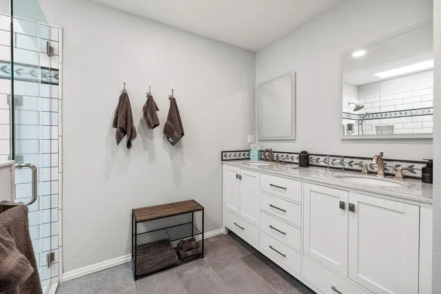 a kitchen with a refrigerator and a sink